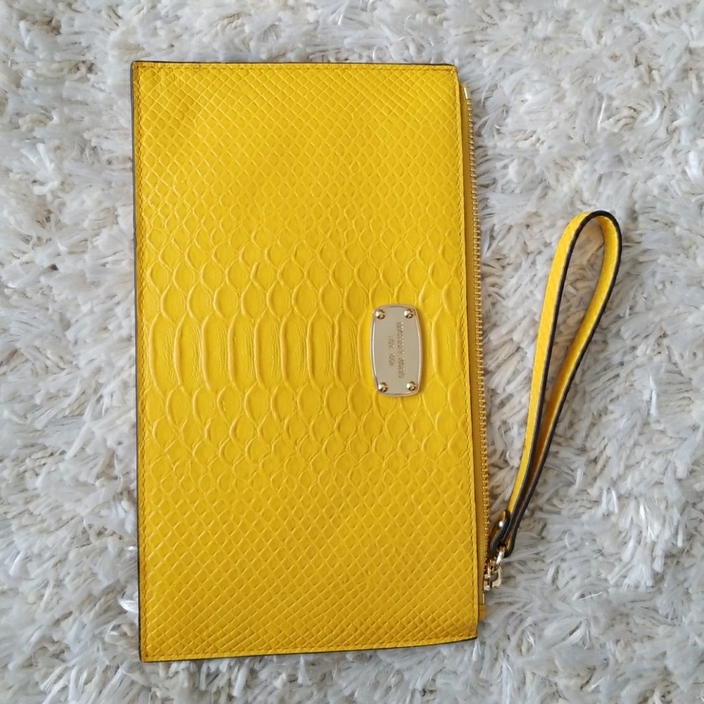 Michael Kors zip clutch with embossed leather.